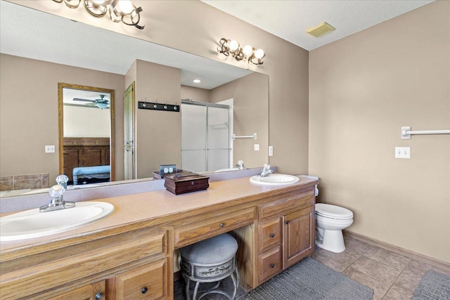 1111 Woods Creek Dr, Delano, MN 55328 - bathroom featuring connected bathroom, double vanity, a shower stall, and tile patterned floors