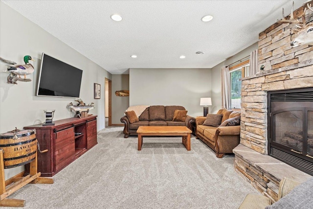 1111 Woods Creek Dr, Delano, MN 55328 - living area featuring carpet flooring, a fireplace, a textured ceiling, and recessed lighting