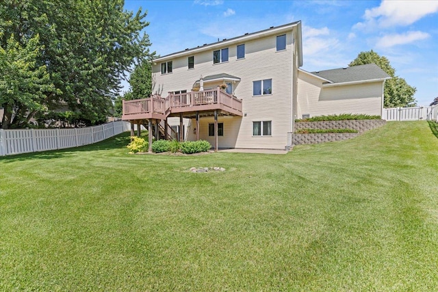 1111 Woods Creek Dr, Delano, MN 55328 - rear view of house with a fenced backyard, a wooden deck, and stairway
