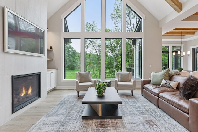4864 148th Ave, Ham Lake, MN 55304 - living area featuring plenty of natural light, light wood finished floors, high vaulted ceiling, and beamed ceiling
