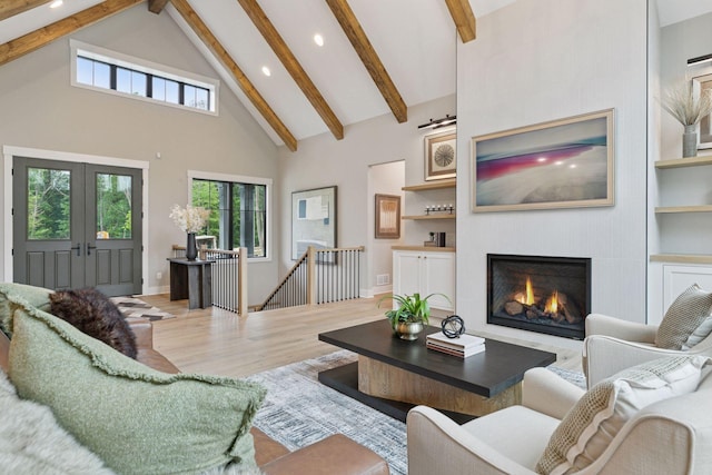 4864 148th Ave, Ham Lake, MN 55304 - living area featuring high vaulted ceiling, beamed ceiling, recessed lighting, a fireplace, and french doors