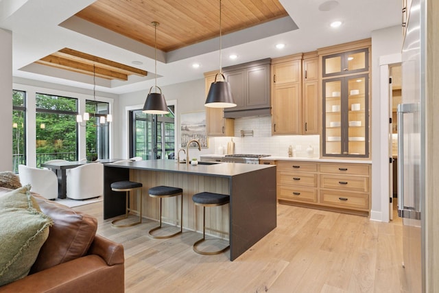4864 148th Ave, Ham Lake, MN 55304 - kitchen with a raised ceiling, open floor plan, wooden ceiling, light wood-type flooring, and decorative backsplash