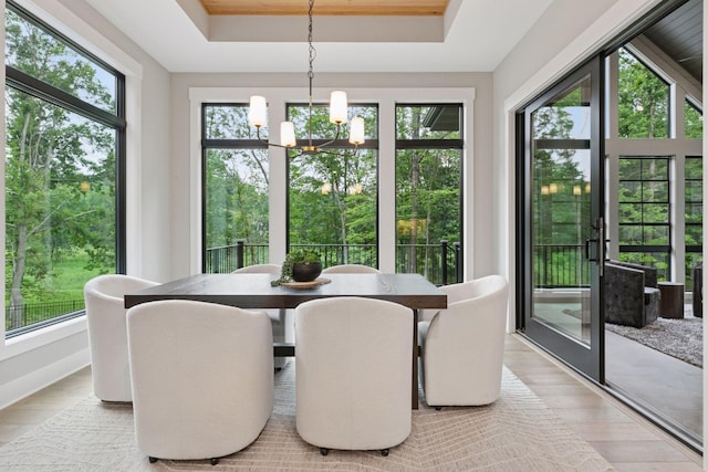 4864 148th Ave, Ham Lake, MN 55304 - sunroom / solarium featuring a chandelier and plenty of natural light