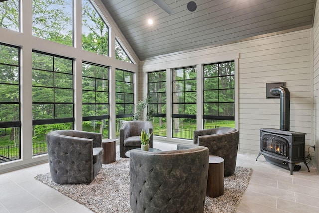 4864 148th Ave, Ham Lake, MN 55304 - sunroom featuring vaulted ceiling, a wood stove, and a ceiling fan