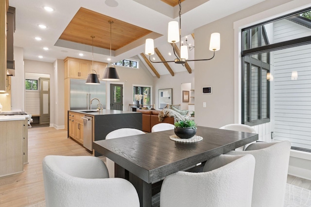 4864 148th Ave, Ham Lake, MN 55304 - dining room featuring light wood-style flooring, recessed lighting, a raised ceiling, and a chandelier