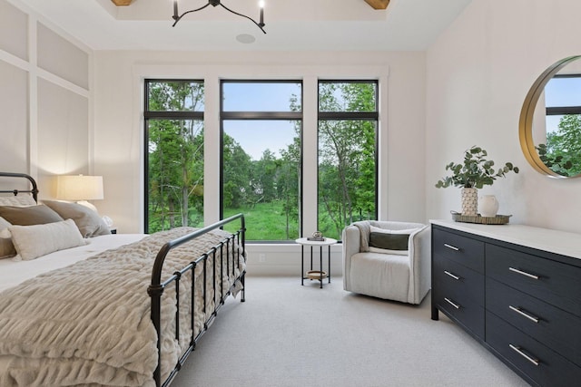 4864 148th Ave, Ham Lake, MN 55304 - bedroom featuring light colored carpet and a chandelier