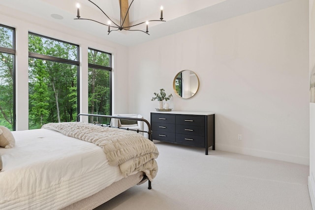4864 148th Ave, Ham Lake, MN 55304 - bedroom featuring light carpet and a chandelier