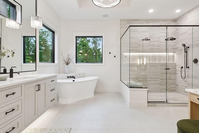 4864 148th Ave, Ham Lake, MN 55304 - full bath featuring vanity, a shower stall, a freestanding bath, recessed lighting, and tile patterned floors
