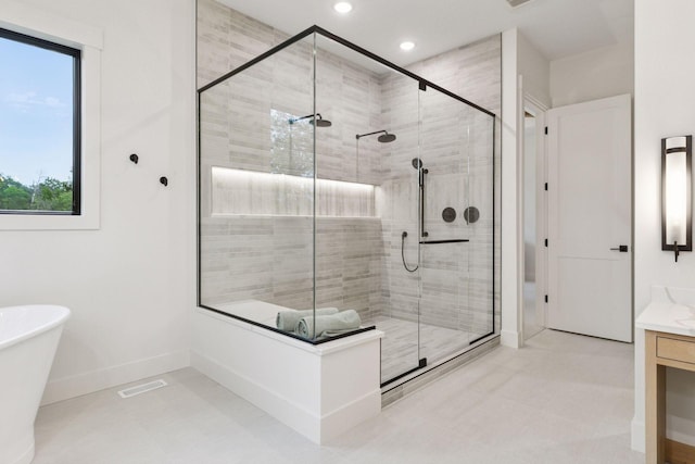 4864 148th Ave, Ham Lake, MN 55304 - bathroom featuring a stall shower, a freestanding tub, vanity, and recessed lighting