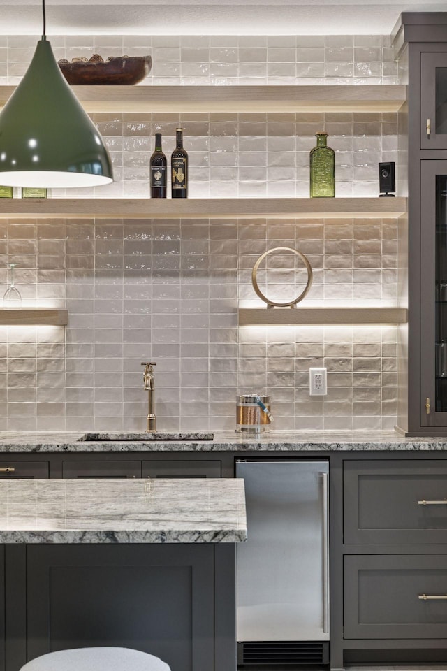 4864 148th Ave, Ham Lake, MN 55304 - bar area featuring refrigerator and decorative backsplash