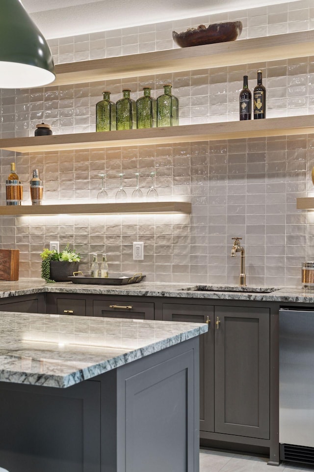 4864 148th Ave, Ham Lake, MN 55304 - bar area featuring decorative backsplash and refrigerator