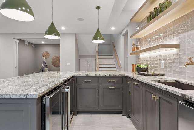 4864 148th Ave, Ham Lake, MN 55304 - kitchen featuring beverage cooler, stainless steel dishwasher, tasteful backsplash, light stone counters, and open shelves