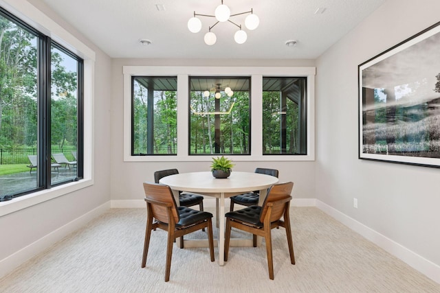 4864 148th Ave, Ham Lake, MN 55304 - dining room featuring a chandelier and light colored carpet