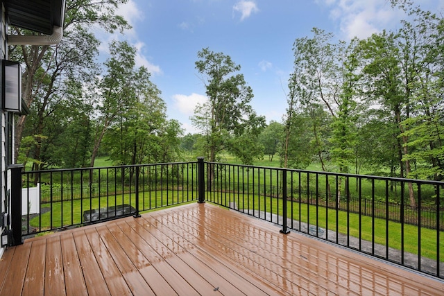 4864 148th Ave, Ham Lake, MN 55304 - wooden deck with a lawn and view of wooded area