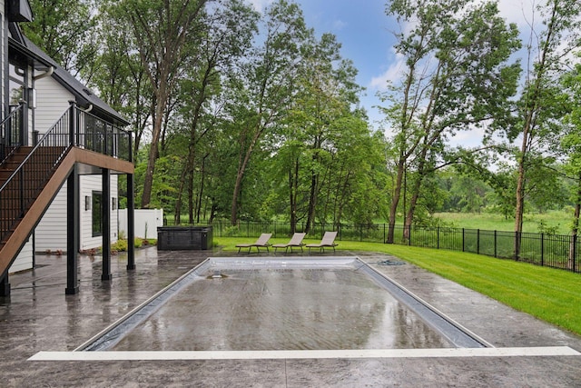 4864 148th Ave, Ham Lake, MN 55304 - exterior space featuring stairs, a fenced backyard, a swimming pool, and view of wooded area