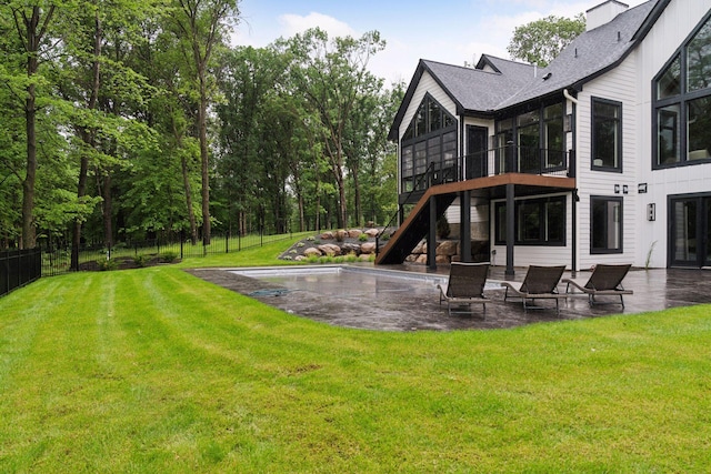 4864 148th Ave, Ham Lake, MN 55304 - rear view of property featuring stairs, a patio area, a swimming pool, a sunroom, and a shingled roof