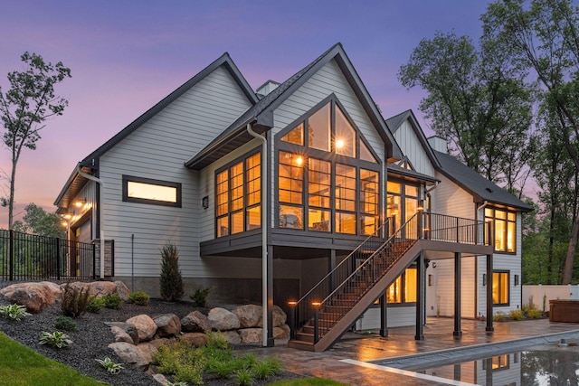 4864 148th Ave, Ham Lake, MN 55304 - back of property featuring a sunroom, stairs, a swimming pool, and a patio area