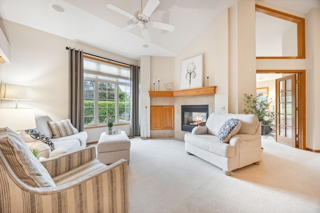 4438 Napier Pkwy NE, Saint Michael, MN 55376 - living area with carpet flooring, a tile fireplace, a ceiling fan, and high vaulted ceiling