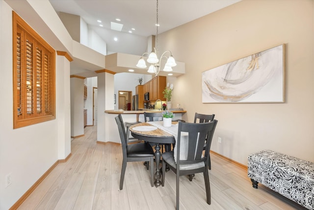 4438 Napier Pkwy NE, Saint Michael, MN 55376 - dining space featuring light wood-type flooring, a chandelier, recessed lighting, and high vaulted ceiling