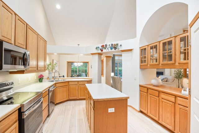 4438 Napier Pkwy NE, Saint Michael, MN 55376 - kitchen featuring appliances with stainless steel finishes, high vaulted ceiling, a kitchen island, light countertops, and a chandelier