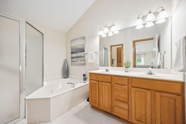4438 Napier Pkwy NE, Saint Michael, MN 55376 - full bathroom with lofted ceiling, a shower stall, double vanity, a garden tub, and tile patterned flooring