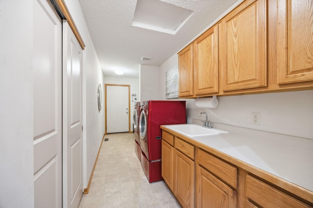 4438 Napier Pkwy NE, Saint Michael, MN 55376 - laundry area with washer and dryer, cabinet space, and a textured ceiling