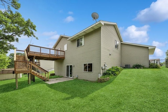 15271 Sodium St NW, Ramsey, MN 55303 - back of house with stairs, a deck, a lawn, and a patio area