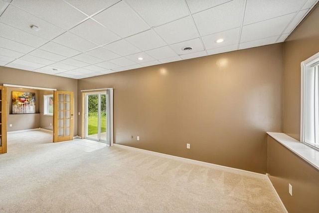 15271 Sodium St NW, Ramsey, MN 55303 - carpeted spare room with a drop ceiling, french doors, and recessed lighting