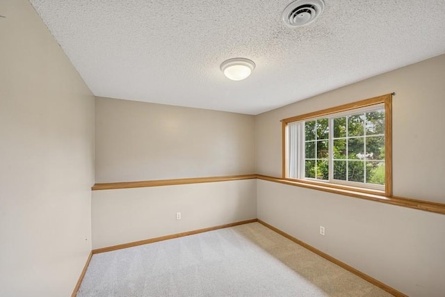 15271 Sodium St NW, Ramsey, MN 55303 - carpeted empty room with baseboards and a textured ceiling