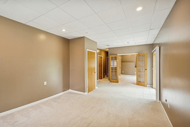 15271 Sodium St NW, Ramsey, MN 55303 - unfurnished room featuring french doors, light colored carpet, a paneled ceiling, and recessed lighting