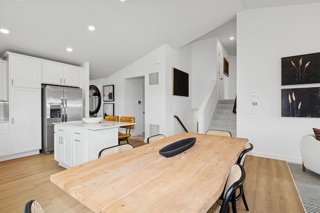 2333 Jandell Ave NE, Saint Michael, MN 55376 - dining space featuring vaulted ceiling, light wood-style floors, recessed lighting, and stairs