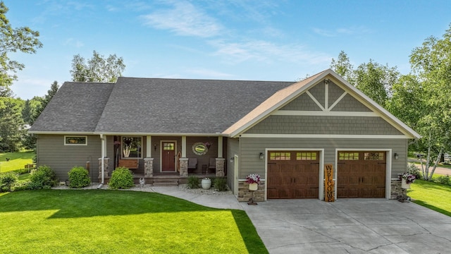 30488 292nd St, Lake Holcombe Twp, WI 54745 - craftsman-style home featuring an attached garage, covered porch, stone siding, a front yard, and concrete driveway