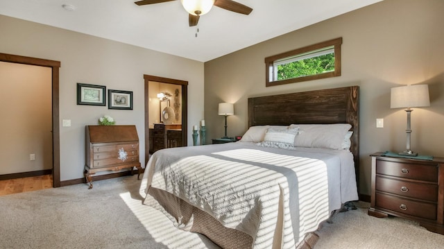 30488 292nd St, Lake Holcombe Twp, WI 54745 - bedroom with light colored carpet, ensuite bath, and ceiling fan