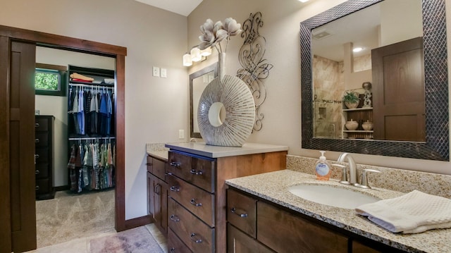 30488 292nd St, Lake Holcombe Twp, WI 54745 - full bathroom with vanity, a walk in closet, and tile patterned floors
