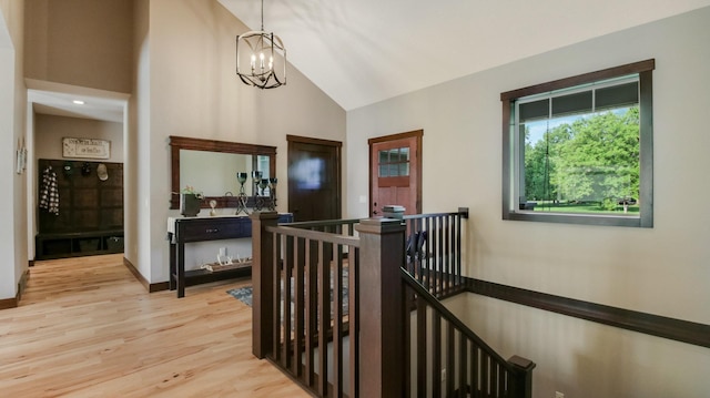 30488 292nd St, Lake Holcombe Twp, WI 54745 - hallway featuring an upstairs landing, a chandelier, light wood-style floors, and high vaulted ceiling