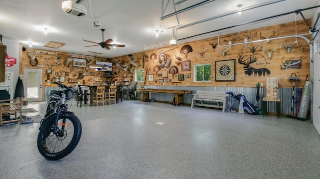 30488 292nd St, Lake Holcombe Twp, WI 54745 - garage featuring a workshop area, a garage door opener, and wooden walls