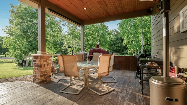 30488 292nd St, Lake Holcombe Twp, WI 54745 - wooden terrace featuring outdoor dining space, view of scattered trees, and a yard