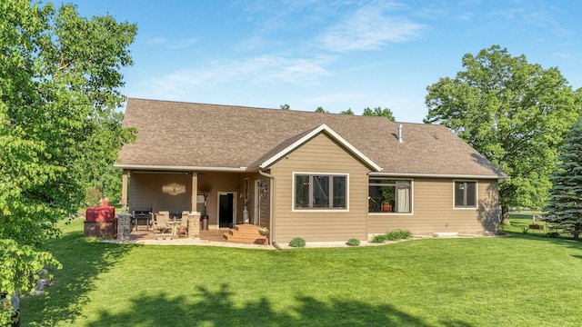 30488 292nd St, Lake Holcombe Twp, WI 54745 - rear view of house with a lawn, a patio area, and roof with shingles