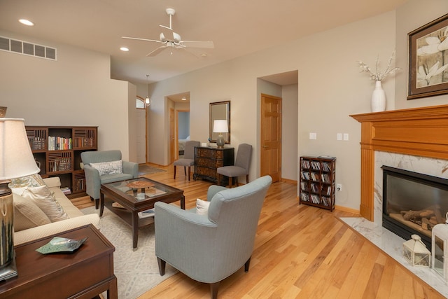 5209 Goodview Ln NW, Rochester, MN 55901 - living room with a ceiling fan, light wood-style floors, a premium fireplace, and recessed lighting