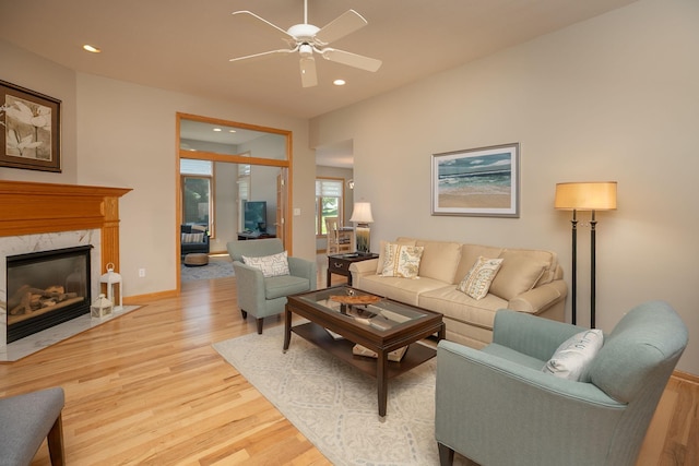 5209 Goodview Ln NW, Rochester, MN 55901 - living area featuring light wood-style flooring, a ceiling fan, recessed lighting, and a fireplace