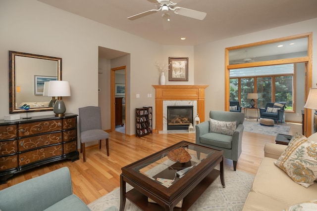 5209 Goodview Ln NW, Rochester, MN 55901 - living area with light wood-style floors, a fireplace, a ceiling fan, and recessed lighting