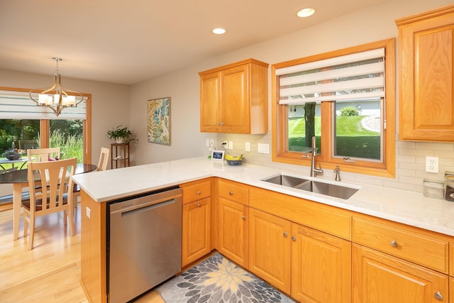5209 Goodview Ln NW, Rochester, MN 55901 - kitchen featuring stainless steel dishwasher, backsplash, a peninsula, recessed lighting, and a chandelier