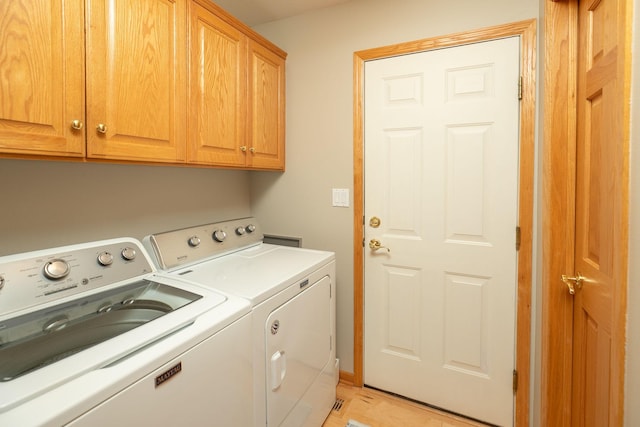 5209 Goodview Ln NW, Rochester, MN 55901 - laundry area with washing machine and clothes dryer and cabinet space