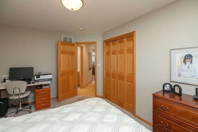 5209 Goodview Ln NW, Rochester, MN 55901 - bedroom with a closet, an office area, and light colored carpet