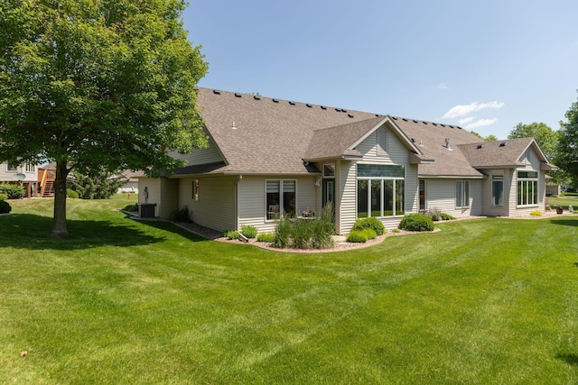 5209 Goodview Ln NW, Rochester, MN 55901 - back of property with a lawn and a shingled roof