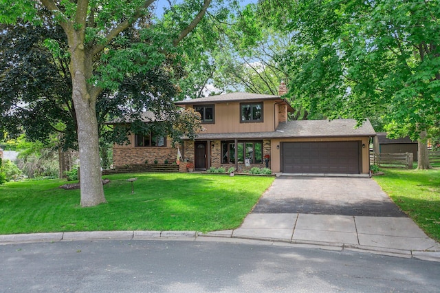 9009 44th Cir N, New Hope, MN 55428 - view of front of property featuring a chimney, asphalt driveway, and an attached garage