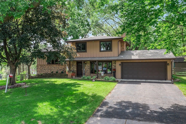 9009 44th Cir N, New Hope, MN 55428 - view of front of home with a garage, asphalt driveway, and a chimney