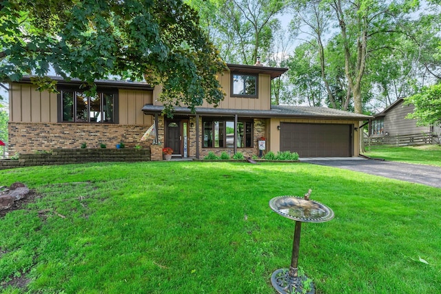 9009 44th Cir N, New Hope, MN 55428 - mid-century inspired home featuring driveway, a garage, a front yard, and board and batten siding
