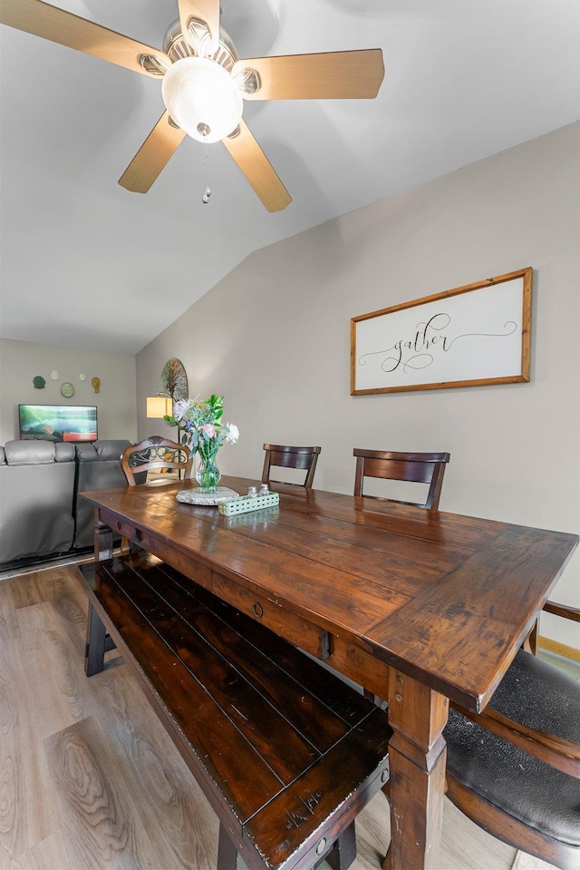 9009 44th Cir N, New Hope, MN 55428 - dining room featuring vaulted ceiling, wood finished floors, and a ceiling fan