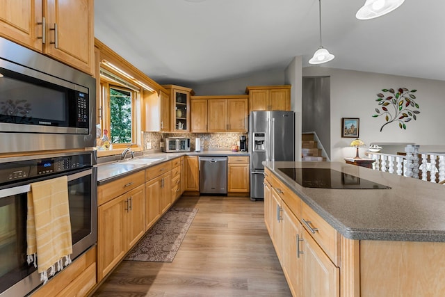 9009 44th Cir N, New Hope, MN 55428 - kitchen with stainless steel appliances, lofted ceiling, light wood-style floors, glass insert cabinets, and decorative backsplash